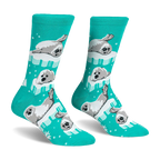 Bright teal crew socks featuring a pattern of fluffy grey and white seal pups resting on light blue and white ice floes.