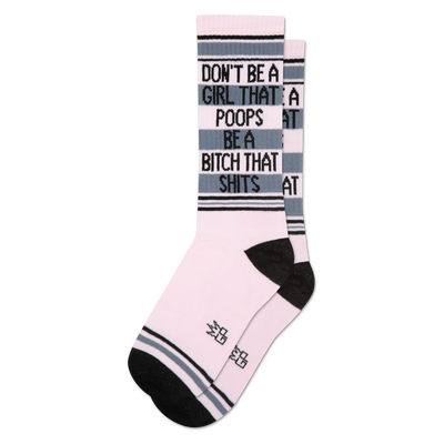 Pink crew socks with black and grey stripes, featuring text 'Don't Be A Girl That Poops Be A Bitch That Shits' on cuff.