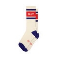 Pair of cream crew socks with red 'SLUT' text, blue-purple stripes on cuff, and blue-purple toe and heel sections.