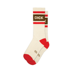 A pair of cream crew socks, one slightly behind the other. They have red striped cuffs, a brown band with "DICK" in white letters, and red heels and toes.