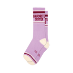 Two lavender crew socks with cream heel/toe. Maroon and white stripes on cuff, 'FAVORITE SISTER' text visible on one sock.