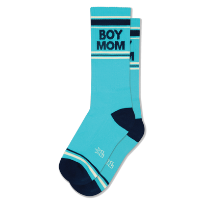 Pair of turquoise crew socks with navy blue 'BOY MOM' text, navy heels/toes, and navy and cream stripes.