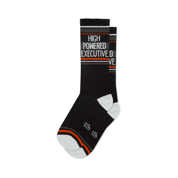 Black crew socks featuring white text reading HIGH POWERED EXECUTIVE, sporty orange and grey stripes, and white heels.