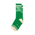 Green athletic crew socks with white stripes, cream toes, and bold text reading MIDDLE CHILD on the upper calf.