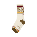 Off-white crew socks reading COFFEE IS MY THERAPIST in brown. Features brown heels, toes, and retro red and yellow stripes.