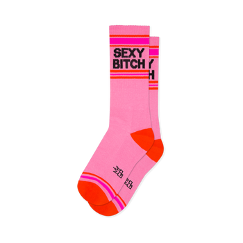 Light pink crew socks with SEXY BITCH in black text, framed by hot pink and orange stripes with bright orange toe and heel.