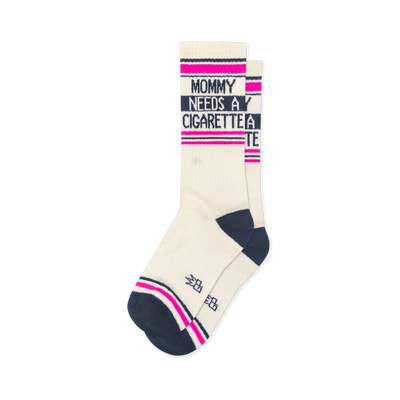 Off-white crew socks with a navy heel and toe, featuring pink and navy stripes and the text Mommy Needs A Cigarette.