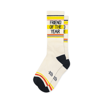 Cream retro socks with black Friend of the Year text, yellow and orange stripes, plus matching black heel and toe caps.