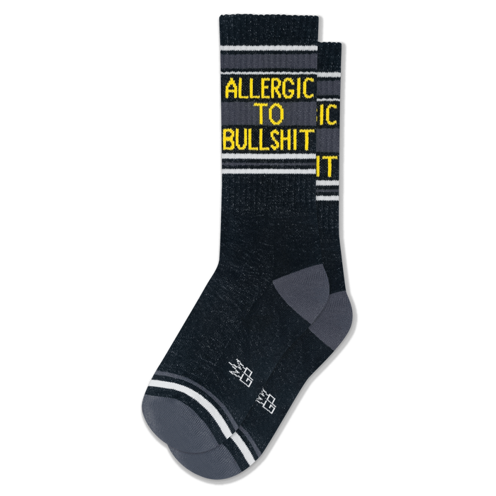 Dark heathered crew socks with grey heels and toes, white stripes, and bright yellow text reading ALLERGIC TO BULLSHIT. }}