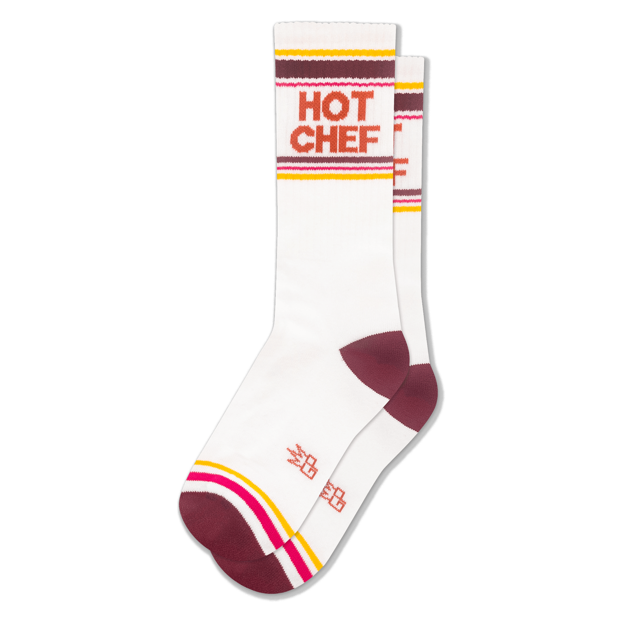 White athletic crew socks with HOT CHEF in bold orange letters, featuring retro stripes in maroon, yellow, pink, and white.