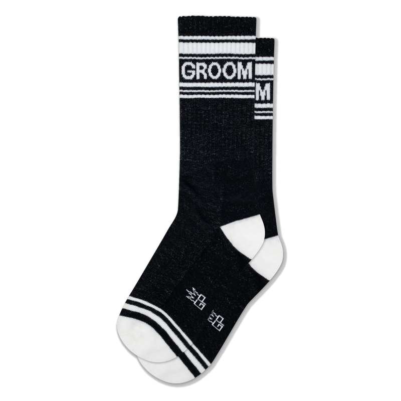 Black crew socks with white stripes at the top and toe, white heels, and the word GROOM in white block letters on the cuff.