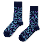 Dark blue crew socks with light blue zodiac symbols like a lion and scales, plus purple stars and crescent moons.