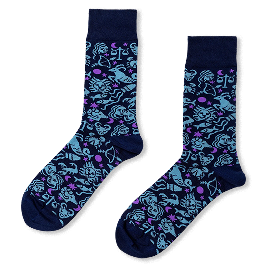 Dark blue crew socks with light blue zodiac symbols like a lion and scales, plus purple stars and crescent moons.