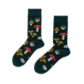 Pair of crew socks in dark green, patterned with various fungi: red with white spots, yellow ruffled, white clusters, and textured yellow mushrooms.