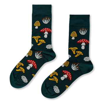 Pair of crew socks in dark green, patterned with various fungi: red with white spots, yellow ruffled, white clusters, and textured yellow mushrooms.