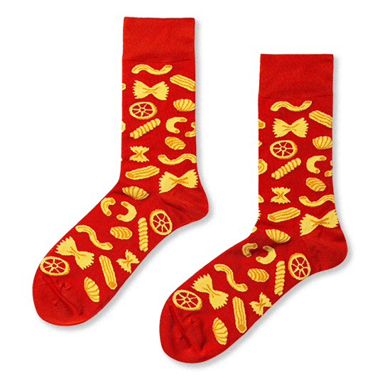 Pair of red crew socks with a repeating yellow pattern of various pasta shapes like farfalle, fusilli, and rotelle. }}