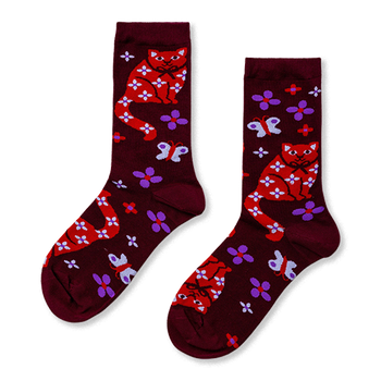 Pair of burgundy crew socks with red cats, white floral patterns, white bows, purple flowers, and white butterflies.