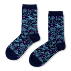 Navy blue crew socks with a scattered pattern of light blue zodiac signs and small purple crescent moons and stars.