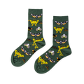 Pair of crew socks in dark green, patterned with various moths including yellow, black and white skull-like, and grey speckled designs.