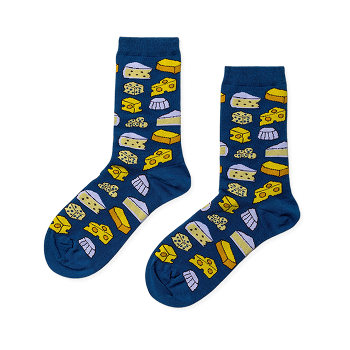 Pair of crew socks with a dark blue base featuring an all-over pattern of various yellow and white cheese shapes. }}