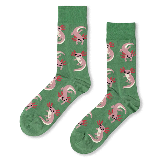 Green crew socks featuring a repeating pattern of light pink axolotls with dark pink gills and smiling faces.