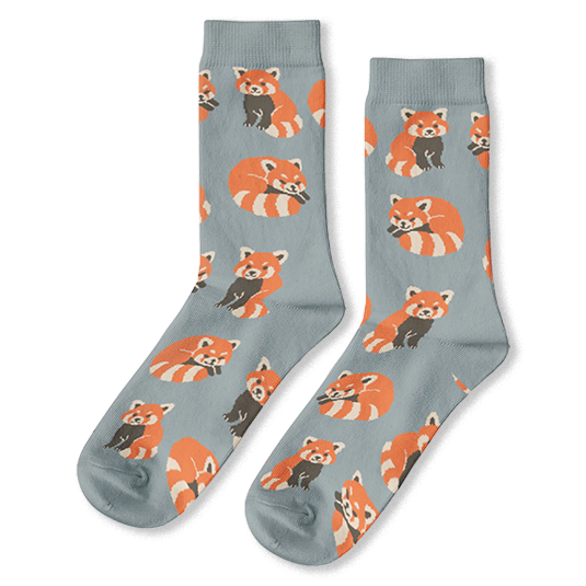 Light dusty blue crew socks with a repeating pattern of orange and brown red pandas in sitting and curled up sleeping poses.