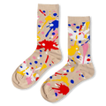 Beige crew socks featuring a chaotic pattern of bright red, blue, yellow, pink, and white paint splatters and dots.