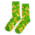 Bright green crew socks with a pattern of yellow bananas, some peeled and some unpeeled, featuring tiny smiling faces.