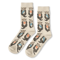Cream crew socks featuring a pattern of brown sea otters floating on their backs holding blue fish and orange shells.