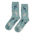 Light blue crew socks with a repeating pattern of dark blue whales and light grey spotted narwhals.
