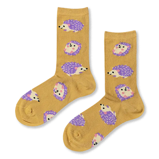 Pair of mustard yellow crew socks featuring a pattern of cute hedgehogs with bright purple quills and little pink feet.