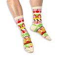 [lf] A person wearing cream crew socks featuring horizontal colorful stripes of pastries, cherries, and citrus slices.