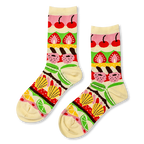 Cream crew socks with colorful horizontal bands showing patisserie items like cherries, strawberries, madeleines, and citrus.