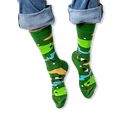 [lf] A person wearing rolled-up blue jeans and green crew socks featuring a colorful golf course pattern with flags and carts.