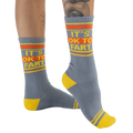 Studio shot: Pair of 'It's Ok to Fart' socks displayed on a white background, showcasing the full design.