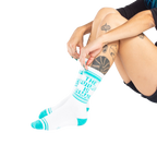 Lifestyle shot of a person's legs wearing the 'The Future is Female' socks.