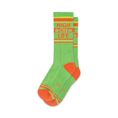 crew, green socks with high on life in orange and white lettering. two orange stripes near top, one at ankle.  