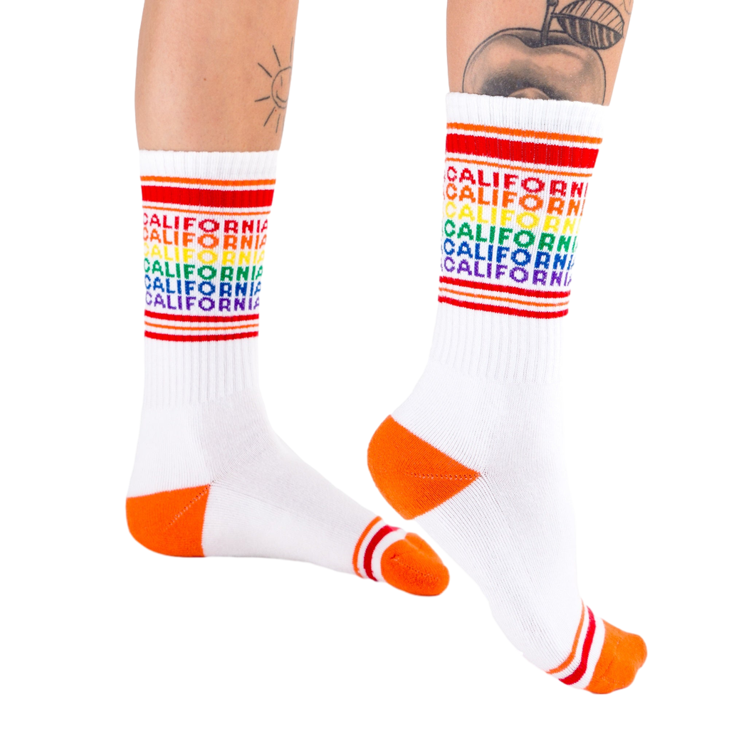 Lifestyle shot: Model wearing the California rainbow socks, showing off the fit and style.