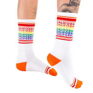 Lifestyle shot: Model wearing the California rainbow socks, showing off the fit and style.