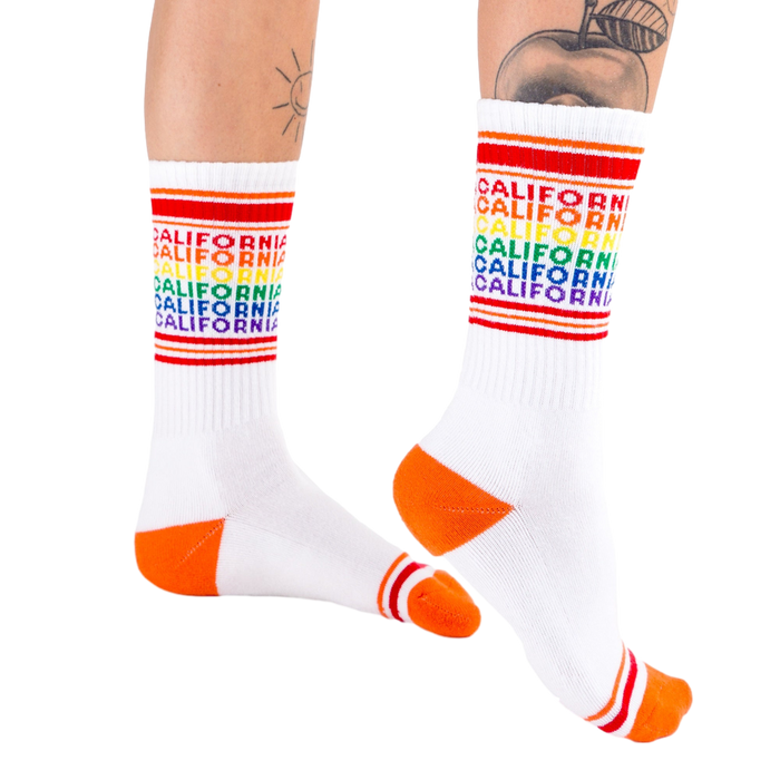 Lifestyle shot: Model wearing the California rainbow socks, showing off the fit and style.