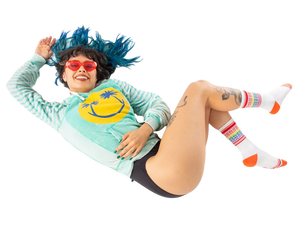 Flatlay product shot:  A pair of California rainbow socks lay flat showcasing design detail.