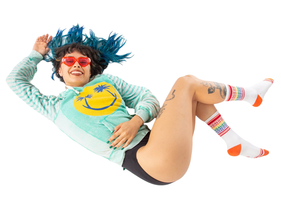 Flatlay product shot:  A pair of California rainbow socks lay flat showcasing design detail.