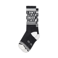 Pair of black crew socks with white stripes and the repeated phrase 'I DON'T WEAR UNDERWEAR'.
