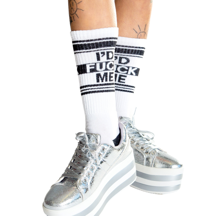 Lifestyle shot: Person wearing white 'I'd Fuck Me' socks, sitting with legs apart.
