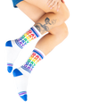 Lifestyle photo: Person's legs wearing the Gay Rainbow socks.