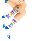 Lifestyle photo: Person's legs wearing the Gay Rainbow socks.