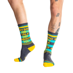 Lifestyle shot:  Person wearing 'My Dog and I Talk Shit About You' socks, showcasing the fit and design.