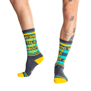 Lifestyle shot:  Person wearing 'My Dog and I Talk Shit About You' socks, showcasing the fit and design.