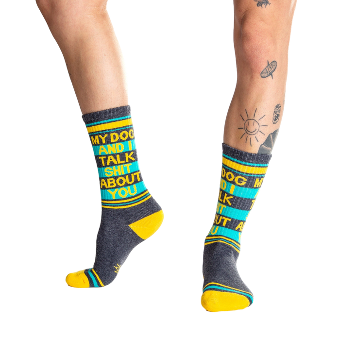 Lifestyle shot:  Person wearing 'My Dog and I Talk Shit About You' socks, showcasing the fit and design.