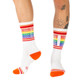 Lifestyle shot of a person wearing the Brooklyn rainbow socks, showing how they look when worn.